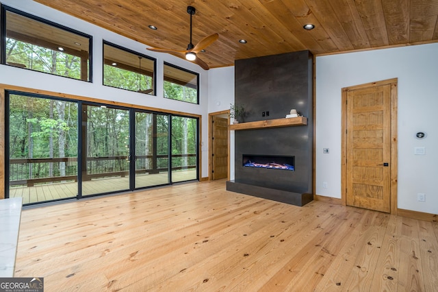 221 Goldmine Rd, Morganton, GA 30560 - unfurnished living room with wooden ceiling, a large fireplace, a ceiling fan, hardwood / wood-style flooring, and recessed lighting