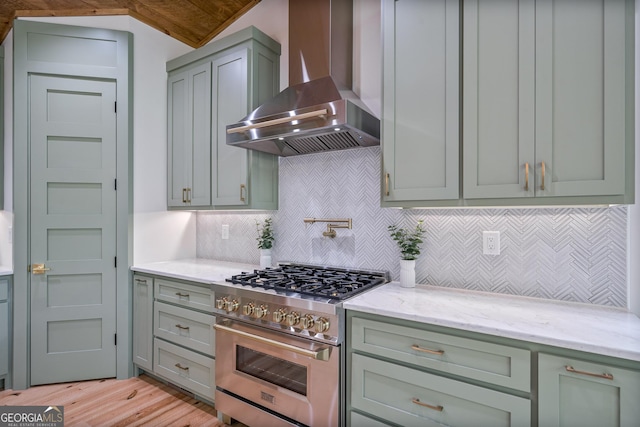 221 Goldmine Rd, Morganton, GA 30560 - kitchen featuring stainless steel range, wall chimney exhaust hood, light wood-style floors, light stone countertops, and decorative backsplash
