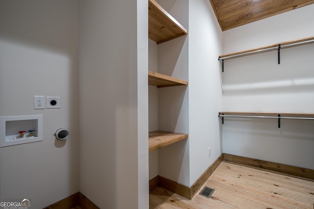 221 Goldmine Rd, Morganton, GA 30560 - laundry room featuring hookup for an electric dryer, hookup for a washing machine, light wood-style floors, and baseboards