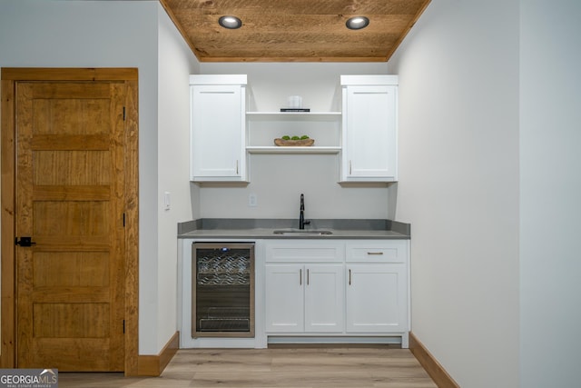 221 Goldmine Rd, Morganton, GA 30560 - indoor wet bar featuring beverage cooler, light wood-style flooring, baseboards, recessed lighting, and crown molding