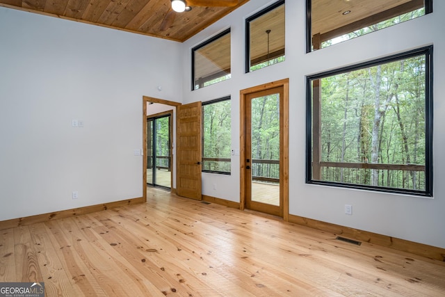 221 Goldmine Rd, Morganton, GA 30560 - empty room with baseboards, hardwood / wood-style floors, wooden ceiling, and a high ceiling