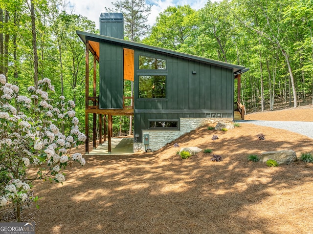 221 Goldmine Rd, Morganton, GA 30560 - view of home's exterior featuring board and batten siding and a chimney