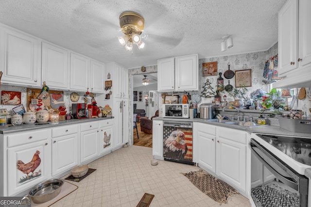 3085 Pea Ridge Rd, Cornelia, GA 30531 - kitchen featuring dishwasher, a ceiling fan, a sink, range with electric cooktop, and white cabinetry
