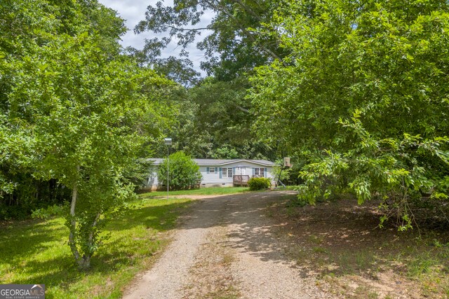3085 Pea Ridge Rd, Cornelia, GA 30531 - view of front of property featuring dirt driveway, a front lawn, and crawl space