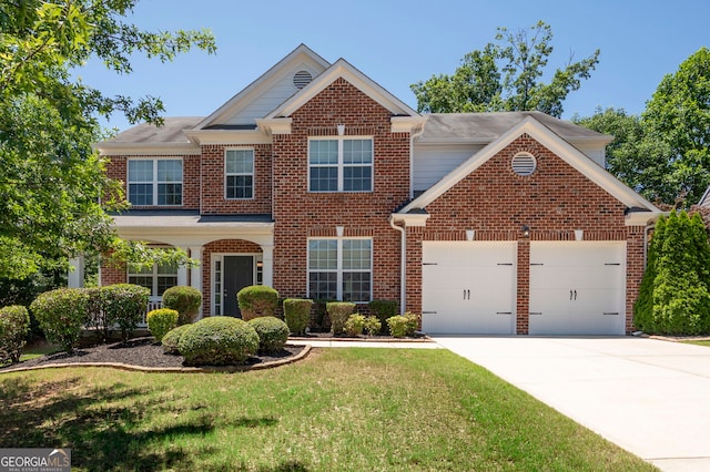 130 Bevington Ln, Woodstock, GA 30188 - view of front of home with an attached garage, concrete driveway, brick siding, and a front yard