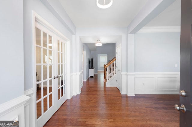 130 Bevington Ln, Woodstock, GA 30188 - hall featuring french doors, wood finished floors, and stairway
