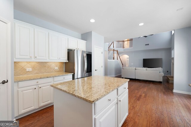 130 Bevington Ln, Woodstock, GA 30188 - kitchen with smart refrigerator, backsplash, a kitchen island, white cabinets, and recessed lighting
