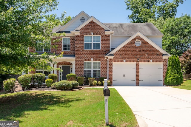 130 Bevington Ln, Woodstock, GA 30188 - view of front of house featuring an attached garage, concrete driveway, a front lawn, and brick siding
