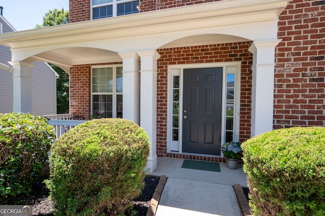 130 Bevington Ln, Woodstock, GA 30188 - doorway to property with brick siding and covered porch