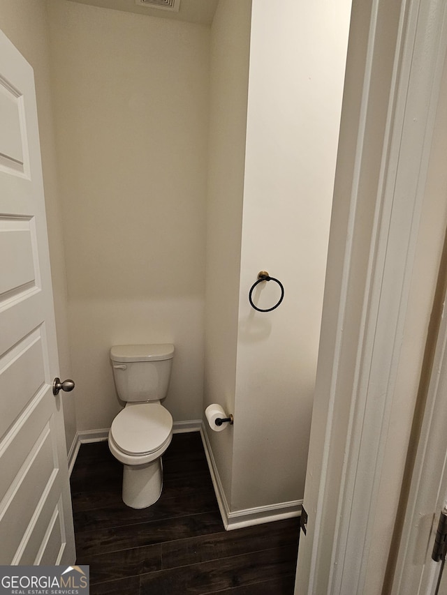 190 Hampton Cir, Mcdonough, GA 30253 - bathroom featuring wood finished floors, toilet, and baseboards