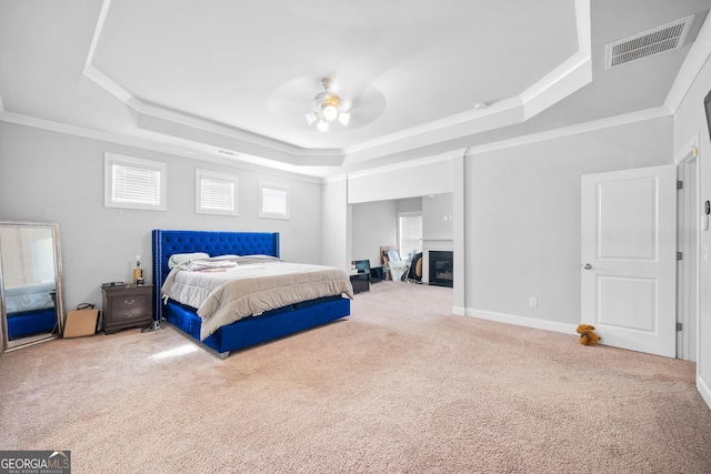 132 Shellbark Dr, Mcdonough, GA 30252 - bedroom with a tray ceiling, carpet flooring, crown molding, and a ceiling fan