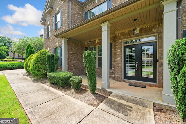 132 Shellbark Dr, Mcdonough, GA 30252 - doorway to property featuring brick siding and a porch