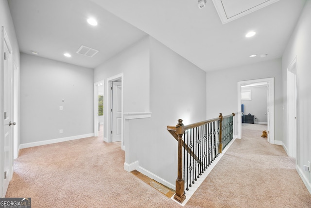 132 Shellbark Dr, Mcdonough, GA 30252 - hallway with carpet, an upstairs landing, recessed lighting, and attic access