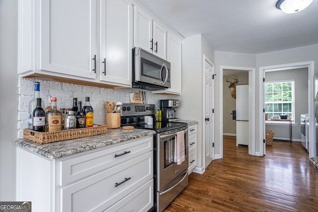 520 Campbell Rd, Cedartown, GA 30125 - kitchen featuring appliances with stainless steel finishes, backsplash, dark wood-style flooring, and white cabinets
