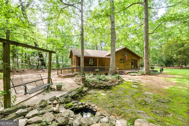 349 Campground Rd, Mcdonough, GA 30253 - back of house featuring log veneer siding and an outdoor fire pit
