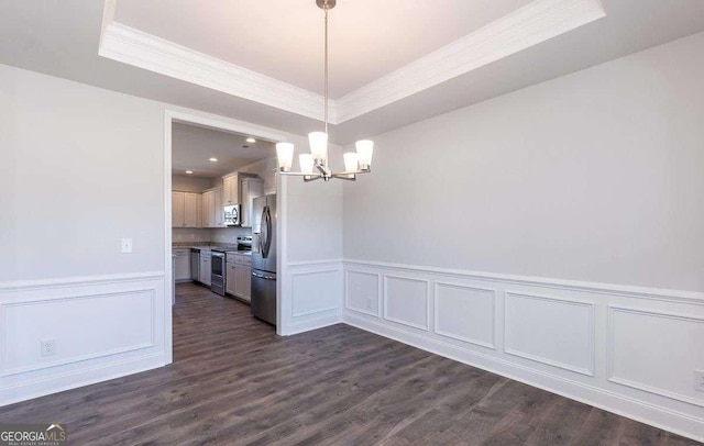 653 Forest Way, Cornelia, GA 30531 - unfurnished dining area featuring crown molding, a chandelier, a raised ceiling, a wainscoted wall, and a decorative wall