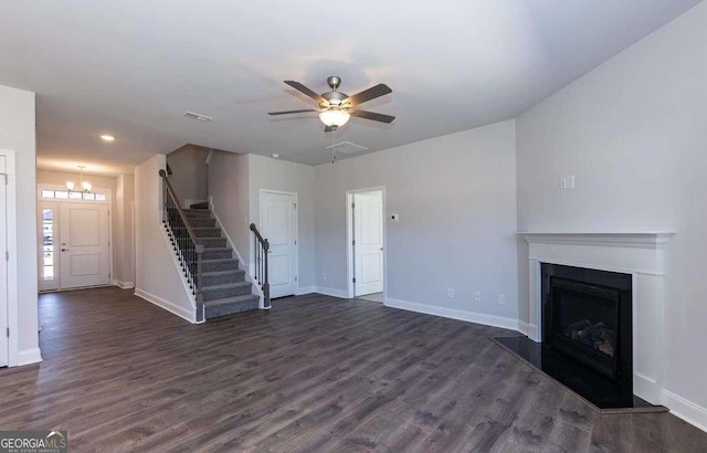 653 Forest Way, Cornelia, GA 30531 - unfurnished living room with stairway, dark wood-style flooring, a fireplace with raised hearth, baseboards, and recessed lighting