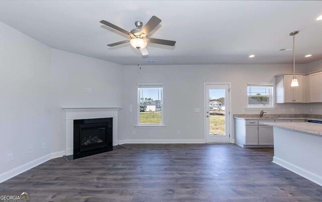 653 Forest Way, Cornelia, GA 30531 - unfurnished living room featuring a sink, healthy amount of natural light, dark wood finished floors, ceiling fan, and recessed lighting