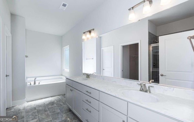 653 Forest Way, Cornelia, GA 30531 - bathroom with a shower stall, a bath, double vanity, a walk in closet, and baseboards
