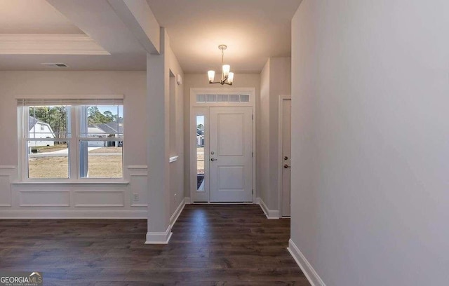653 Forest Way, Cornelia, GA 30531 - entrance foyer featuring a chandelier, dark wood-type flooring, and baseboards