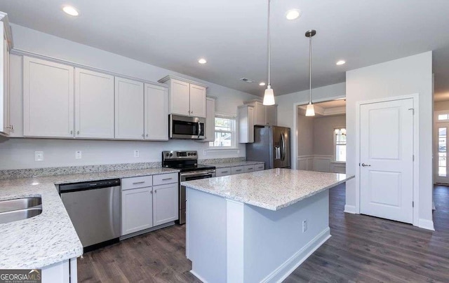 653 Forest Way, Cornelia, GA 30531 - kitchen featuring stainless steel appliances, dark wood finished floors, a center island, healthy amount of natural light, and recessed lighting