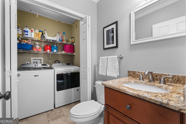 724 Fish Cove Rd, Blairsville, GA 30512 - bathroom with separate washer and dryer, vanity, and toilet