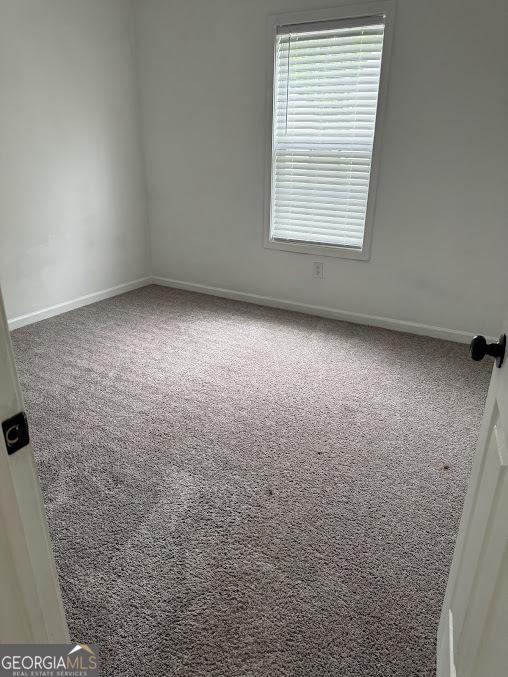 5709 Newnan Cir, Austell, GA 30106 - empty room with carpet and baseboards