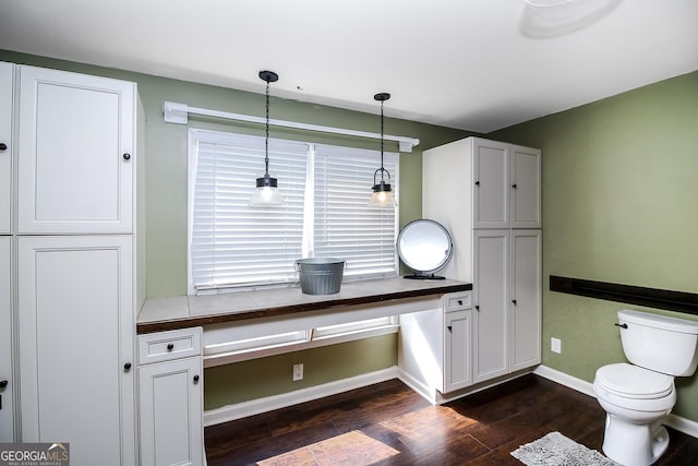 387 Colvin Dr, Locust Grove, GA 30248 - bathroom with wood finished floors, baseboards, and toilet