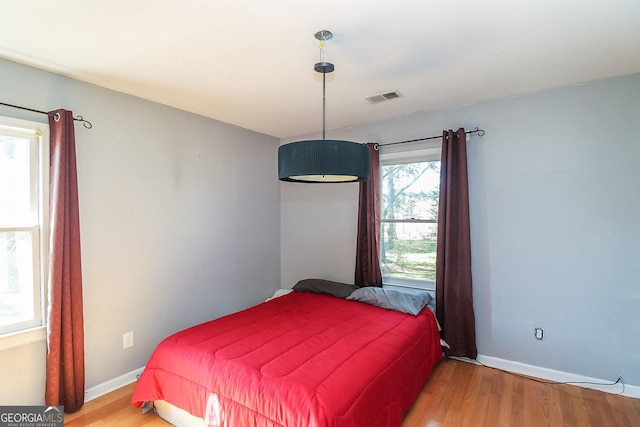 387 Colvin Dr, Locust Grove, GA 30248 - bedroom with wood finished floors and baseboards
