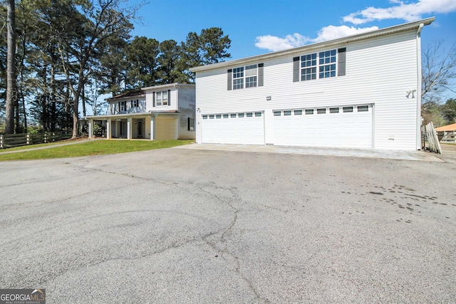 387 Colvin Dr, Locust Grove, GA 30248 - traditional-style home featuring a garage, a front yard, and asphalt driveway