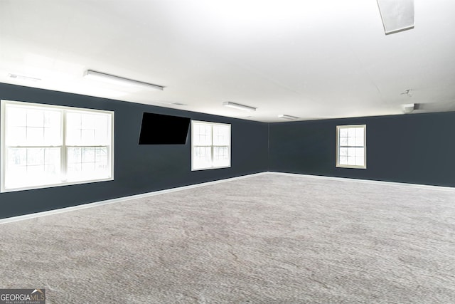 387 Colvin Dr, Locust Grove, GA 30248 - carpeted spare room with healthy amount of natural light and baseboards