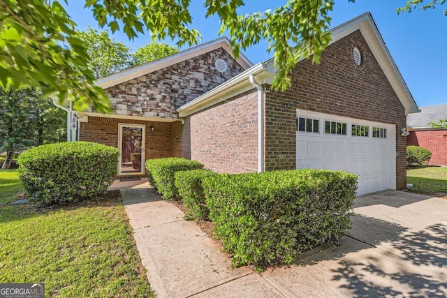 484 Cathedral Dr, Mcdonough, GA 30253 - view of front of home with an attached garage, driveway, and brick siding