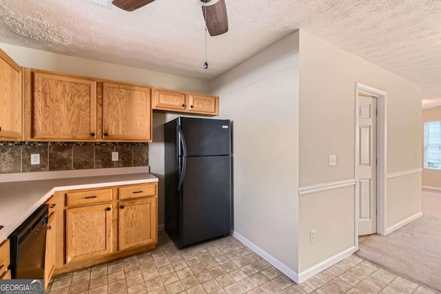 484 Cathedral Dr, Mcdonough, GA 30253 - kitchen with black appliances, ceiling fan, tasteful backsplash, light countertops, and a textured ceiling