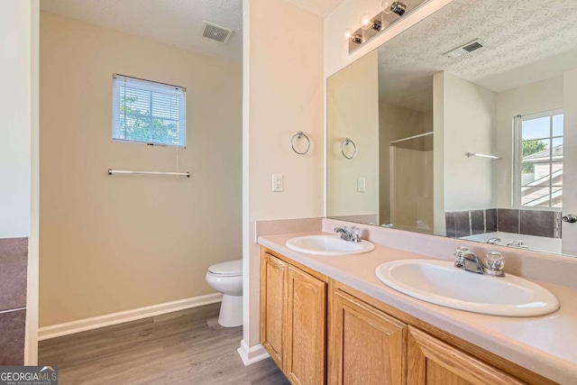 484 Cathedral Dr, Mcdonough, GA 30253 - full bath with toilet, wood finished floors, double vanity, a bathtub, and a shower