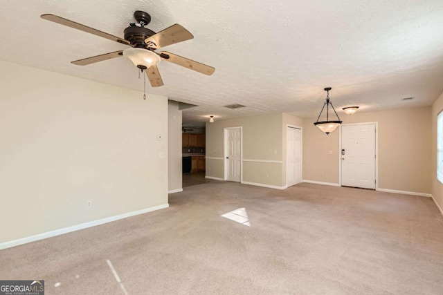484 Cathedral Dr, Mcdonough, GA 30253 - unfurnished living room with carpet floors, baseboards, ceiling fan, and a textured ceiling