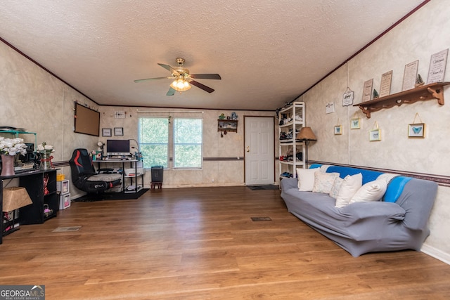 206 Briar Creek Way, Lizella, GA 31052 - living room with wood finished floors, a ceiling fan, and a textured ceiling