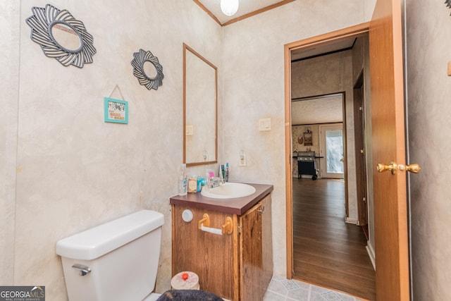 206 Briar Creek Way, Lizella, GA 31052 - bathroom with vanity, toilet, wood finished floors, and crown molding