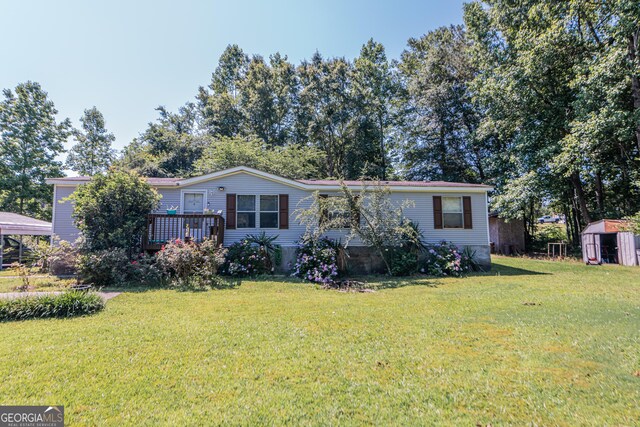 206 Briar Creek Way, Lizella, GA 31052 - manufactured / mobile home with a front lawn and a deck