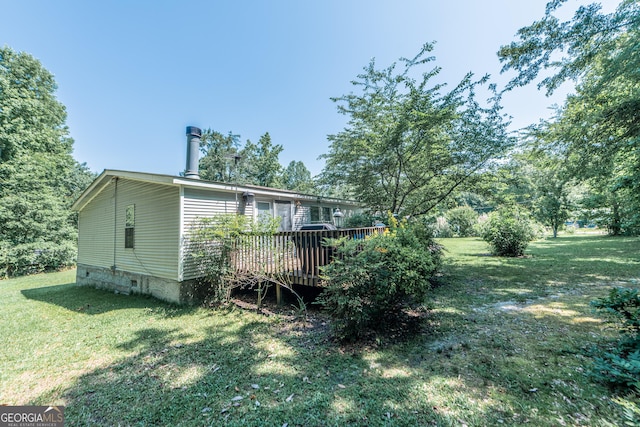 206 Briar Creek Way, Lizella, GA 31052 - view of side of home with a wooden deck and a lawn