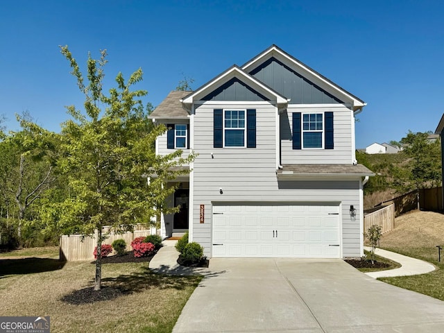 3836 Saddle Hill Way, Douglasville, GA 30135 - view of front of house featuring an attached garage, concrete driveway, and board and batten siding
