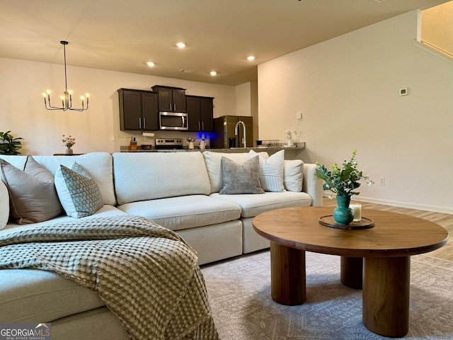 3836 Saddle Hill Way, Douglasville, GA 30135 - living room with a chandelier, recessed lighting, and baseboards