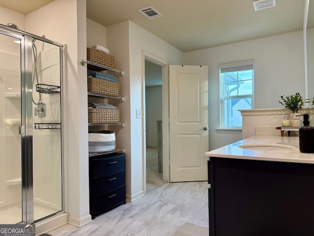 3836 Saddle Hill Way, Douglasville, GA 30135 - full bathroom featuring a shower stall, vanity, marble finish floors, and baseboards
