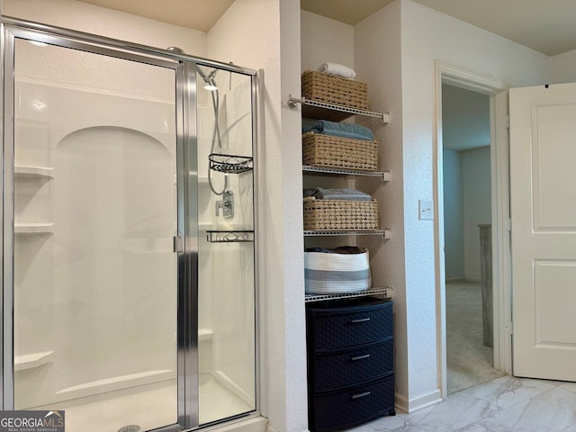 3836 Saddle Hill Way, Douglasville, GA 30135 - bathroom with a shower stall, marble finish floors, and baseboards