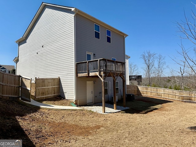 3836 Saddle Hill Way, Douglasville, GA 30135 - back of house featuring a fenced backyard and a deck