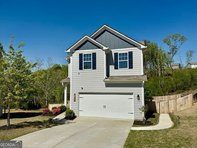 3836 Saddle Hill Way, Douglasville, GA 30135 - view of front of house with a garage, driveway, and board and batten siding