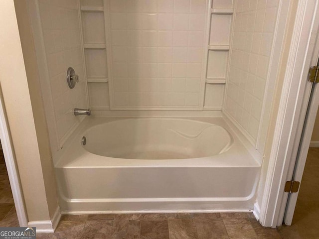 2858 Parkway Close, Lithonia, GA 30058 - bathroom with baseboards and shower / tub combination