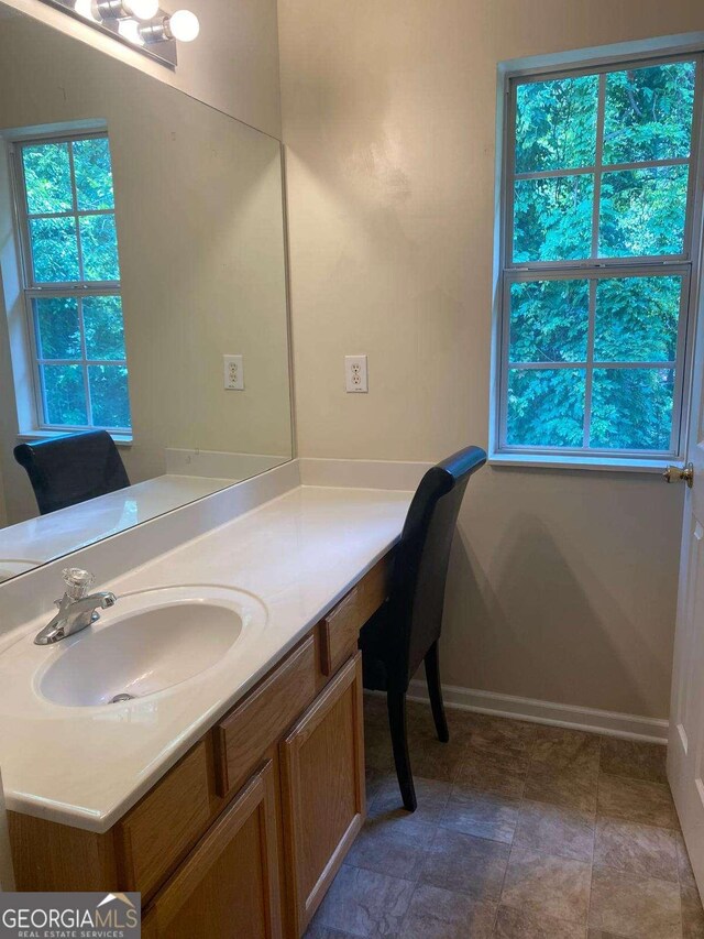 2858 Parkway Close, Lithonia, GA 30058 - bathroom featuring vanity and baseboards