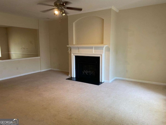 2858 Parkway Close, Lithonia, GA 30058 - unfurnished living room with carpet floors, a ceiling fan, a fireplace with flush hearth, baseboards, and crown molding