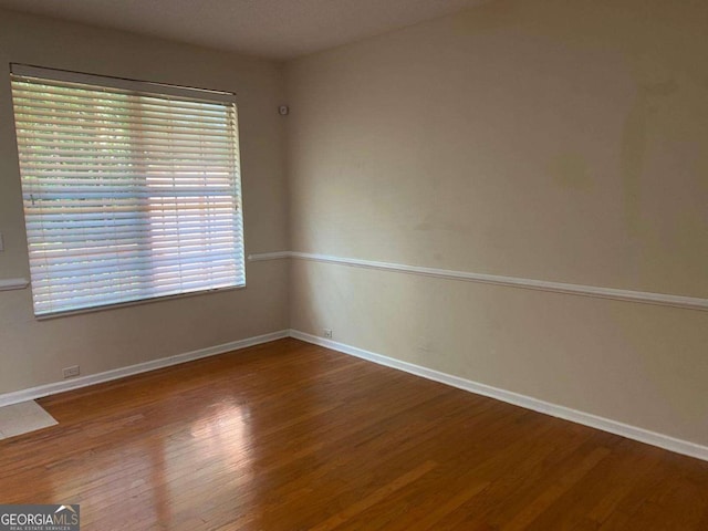 2858 Parkway Close, Lithonia, GA 30058 - spare room with wood finished floors and baseboards