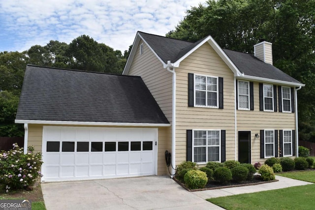 3109 Windgate Dr, Buford, GA 30519 - colonial-style house featuring driveway, a chimney, and a garage